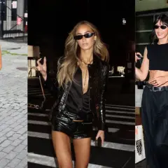 Tres mujeres con atuendos negros, una con botas de cuero y shorts, otra con chaqueta brillante y shorts, y la tercera con top corto y pantalones anchos, evocan un estilo glam rock.
