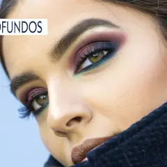 Ojos profundos con maquillaje vibrante, sombras moradas, azules y verdes que realzan la mirada, ideal para la colorimetría invierno profundo.