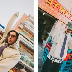 Ralphie Choo, con sudadera y corbata, posa con estilo urbano frente a un almacén.