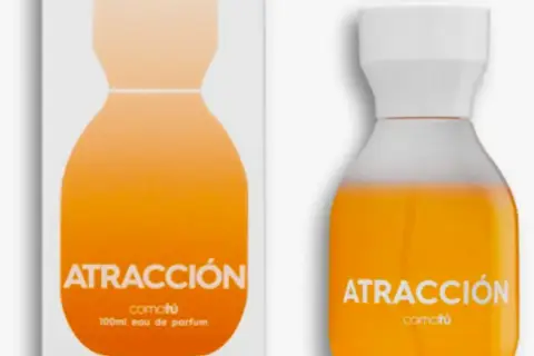 Perfume "Atracción" de Comotú, un eau de parfum para ella de Mercadona, con un diseño naranja vibrante.