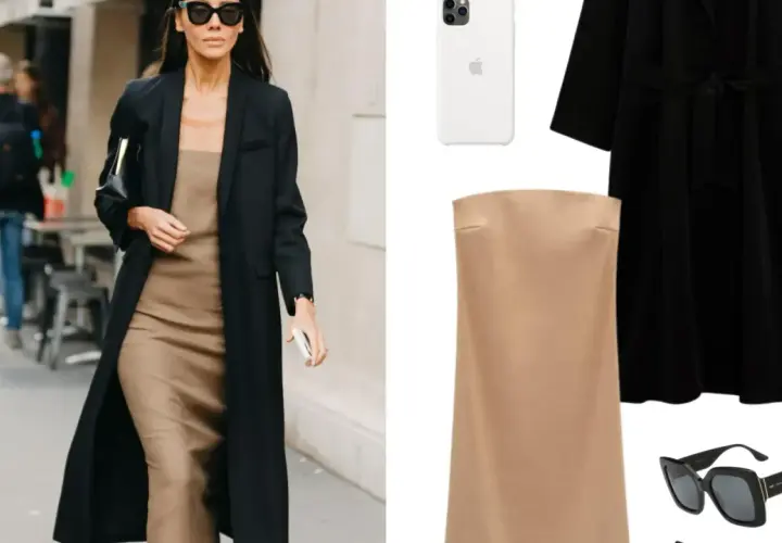 Mujer con estilo parisino, abrigo negro, vestido lencero beige, bolso negro y gafas de sol.