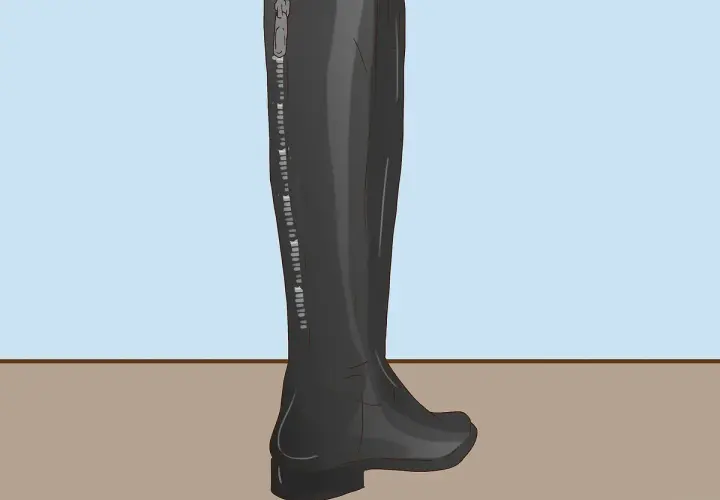 Bota alta negra con cremallera lateral, ideal para aprender como dar de si unas botas altas y lograr un ajuste perfecto.