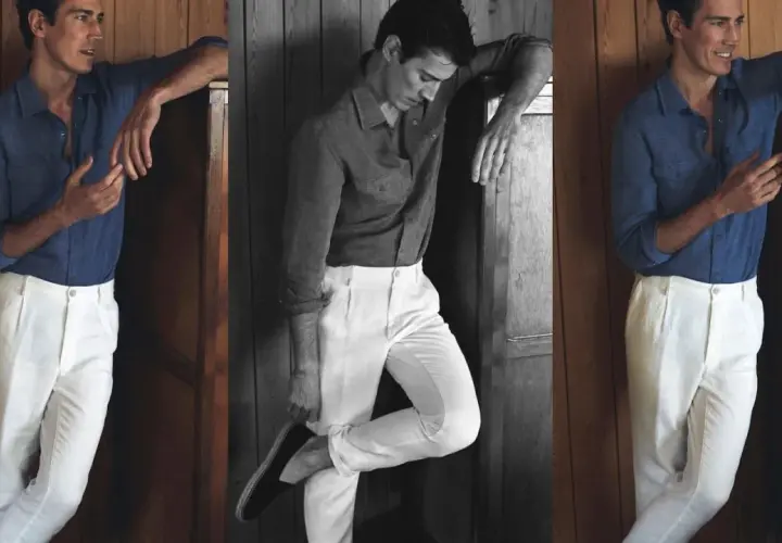 Hombre con camisa azul y pantalón blanco, un look ideal que combinar con pantalón blanco hombre para un estilo veraniego y elegante.