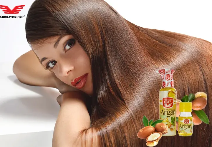 Mujer con cabello largo y sedoso, realzado por el hair oiling con aceite de argán.