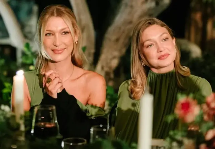 Alana Hadid y Gigi Hadid disfrutan de una cena íntima, con velas y flores, ambas luciendo elegantes vestidos verdes.