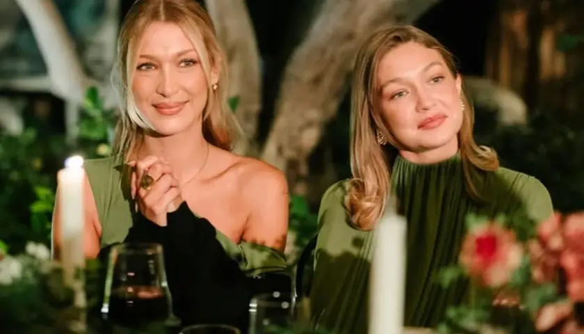 Alana Hadid y Gigi Hadid disfrutan de una cena íntima, con velas y flores, ambas luciendo elegantes vestidos verdes.
