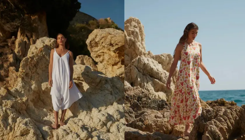 Mujer con vestido blanco y otro estampado de coral, sobre rocas. La tela viscosa que es, se ve ligera y fresca.