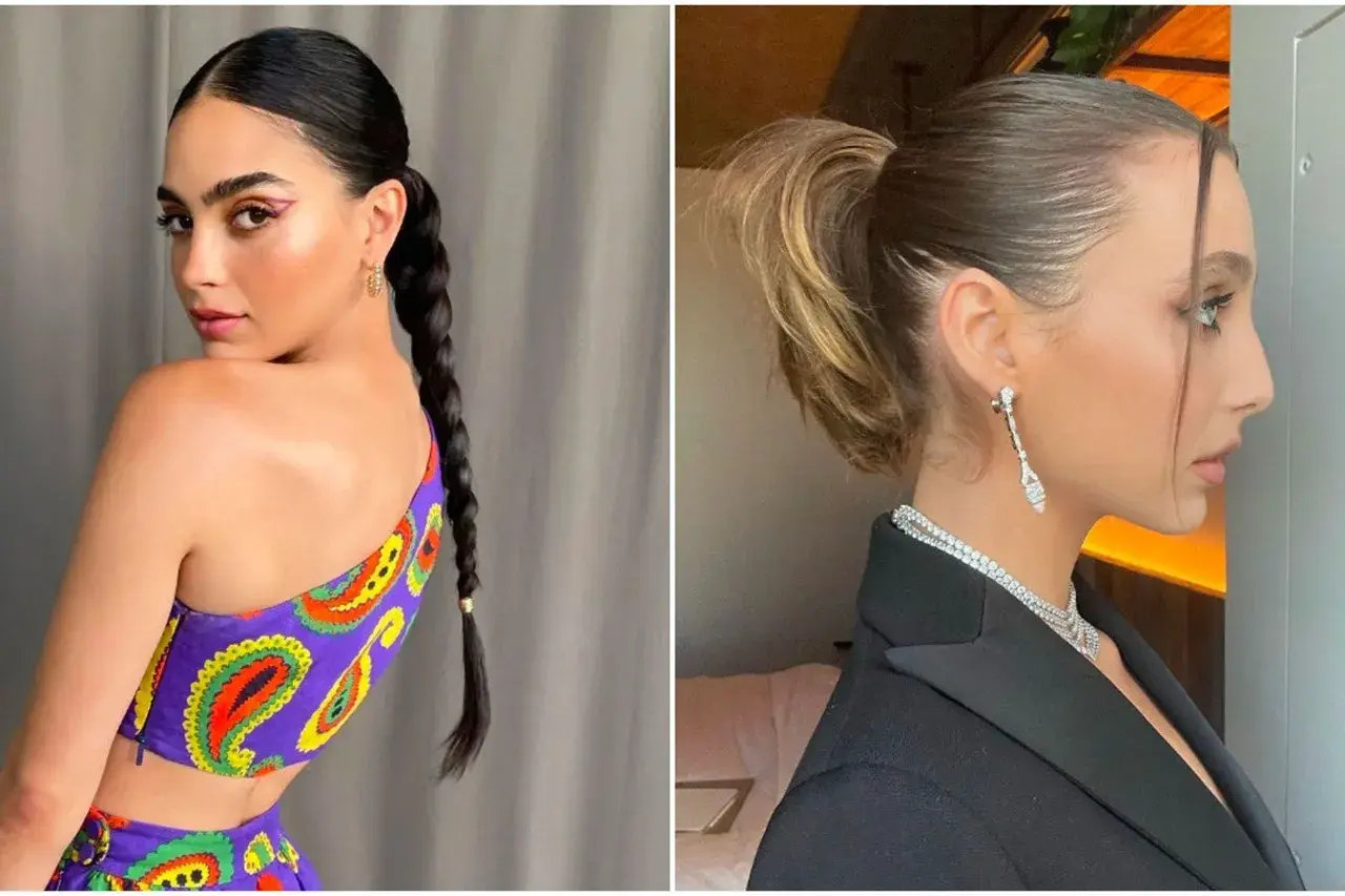 Dos mujeres con peinados recogidos. Una luce un top morado con estampado paisley y una trenza larga. La otra, de perfil, lleva un blazer negro y joyas brillantes. A pesar de los peinados, se percibe un ligero brillo que sugiere pelo graso.