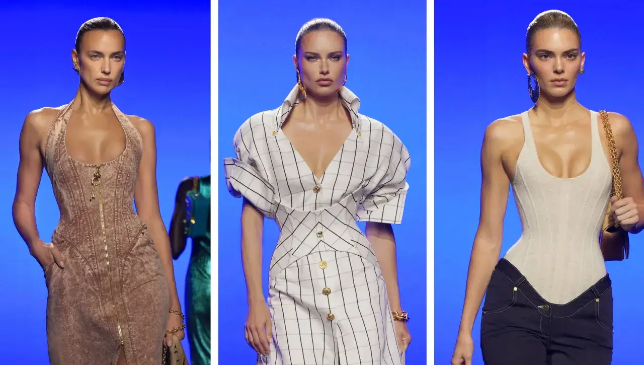 Adriana Lima actual luce un vestido a cuadros con mangas abullonadas. A su lado, otras modelos desfilan con atuendos de moda.