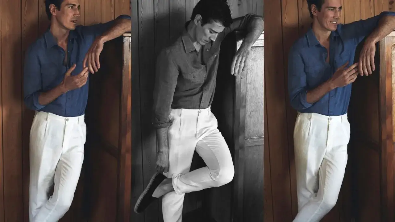 Hombre con camisa azul y pantalón blanco, un look ideal que combinar con pantalón blanco hombre para un estilo veraniego y elegante.
